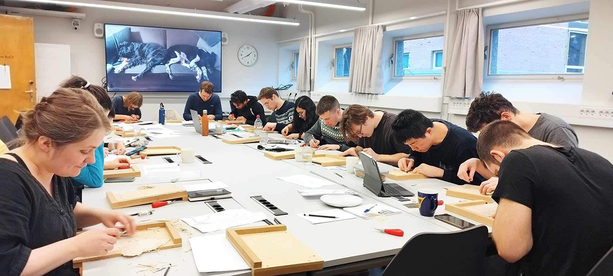 A group of young students doing artwork
