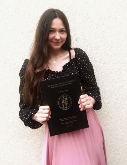photo portrait of Jowita holding her thesis