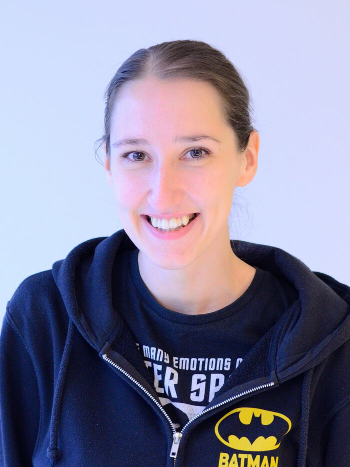 Portrait photo of a young, smiling woman
