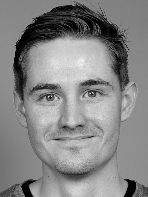 Portrait photo of a young person with glasses