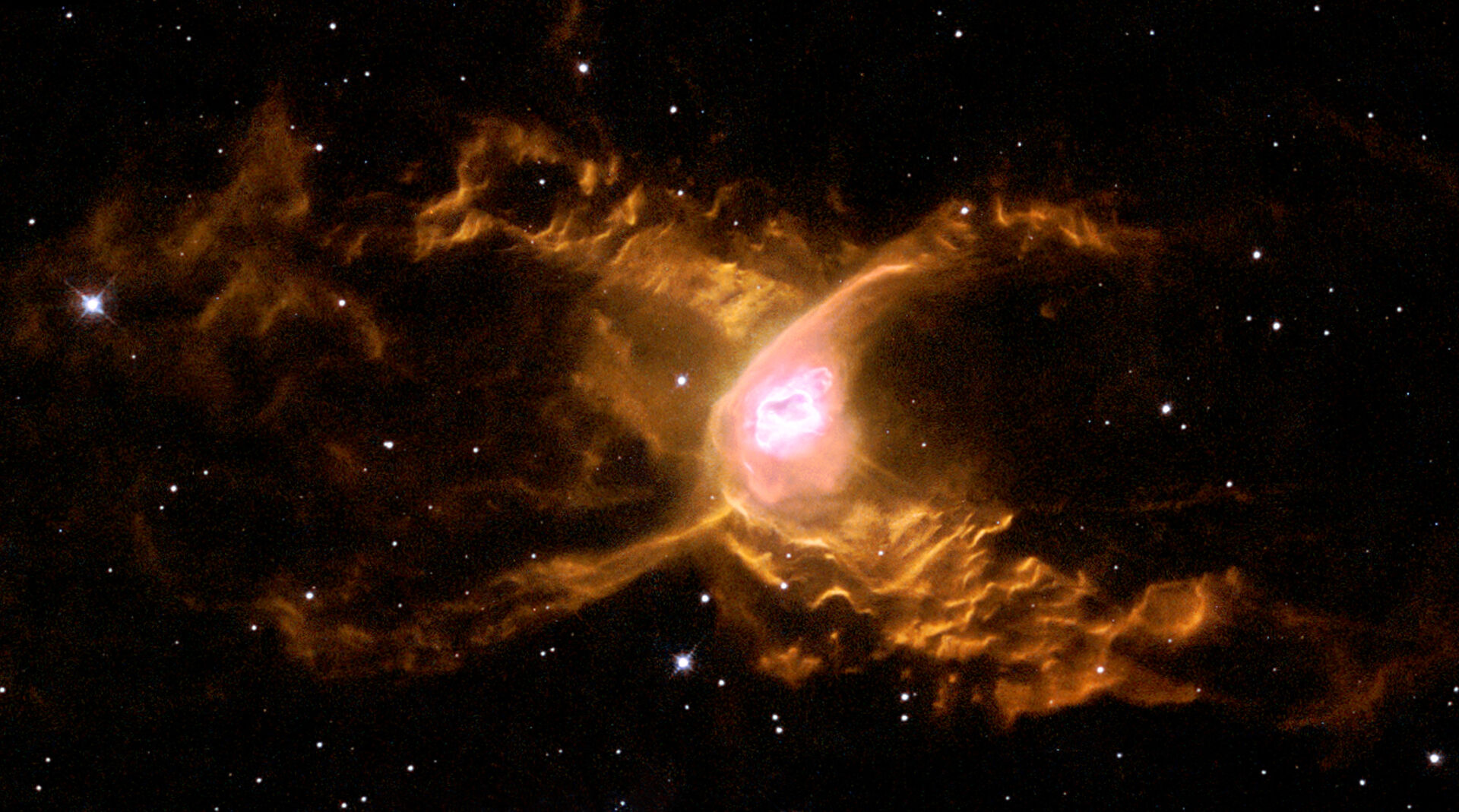 Image of a nebula surrounding a central white dwarf star.