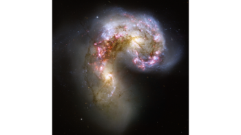The two spiral galaxies started to interact a few hundred million years ago, making the Antennae galaxies one of the nearest and youngest examples of a pair of colliding galaxies. Nearly half of the faint objects in the Antennae image are young clusters containing tens of thousands of stars. The Antennae galaxies take their name from the long antenna-like "arms" extending far out from the nuclei of the two galaxies, best seen by ground-based telescopes.