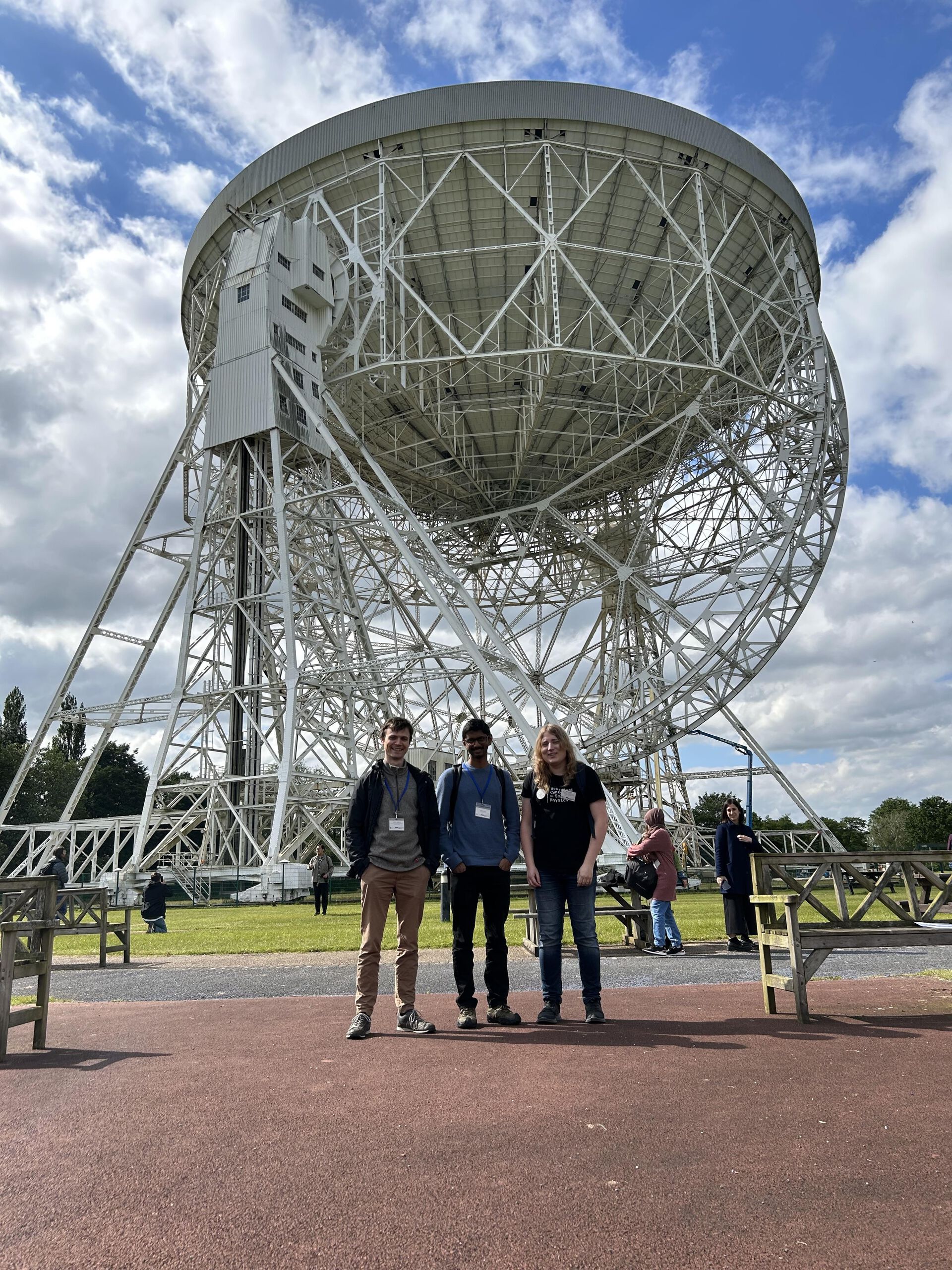 Antenna, sky, people standing in front