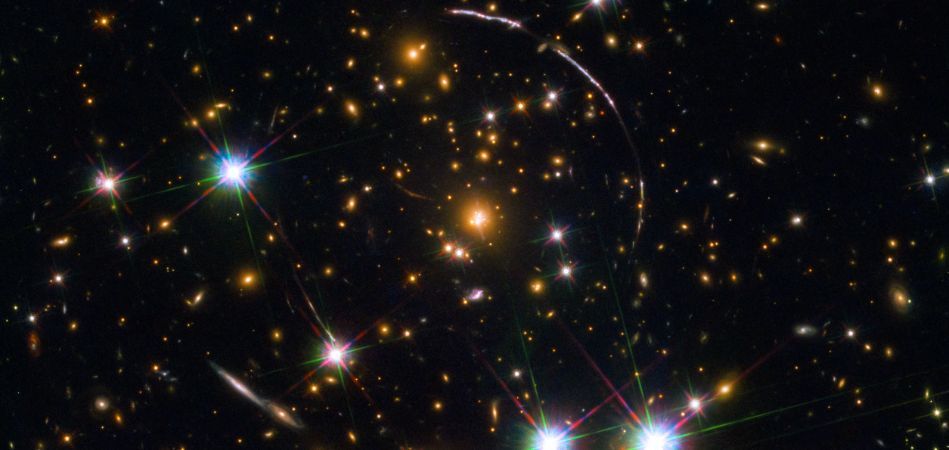 Image form Hubble Space Telescope of the Sunburst galaxy, gravitationally lensed.