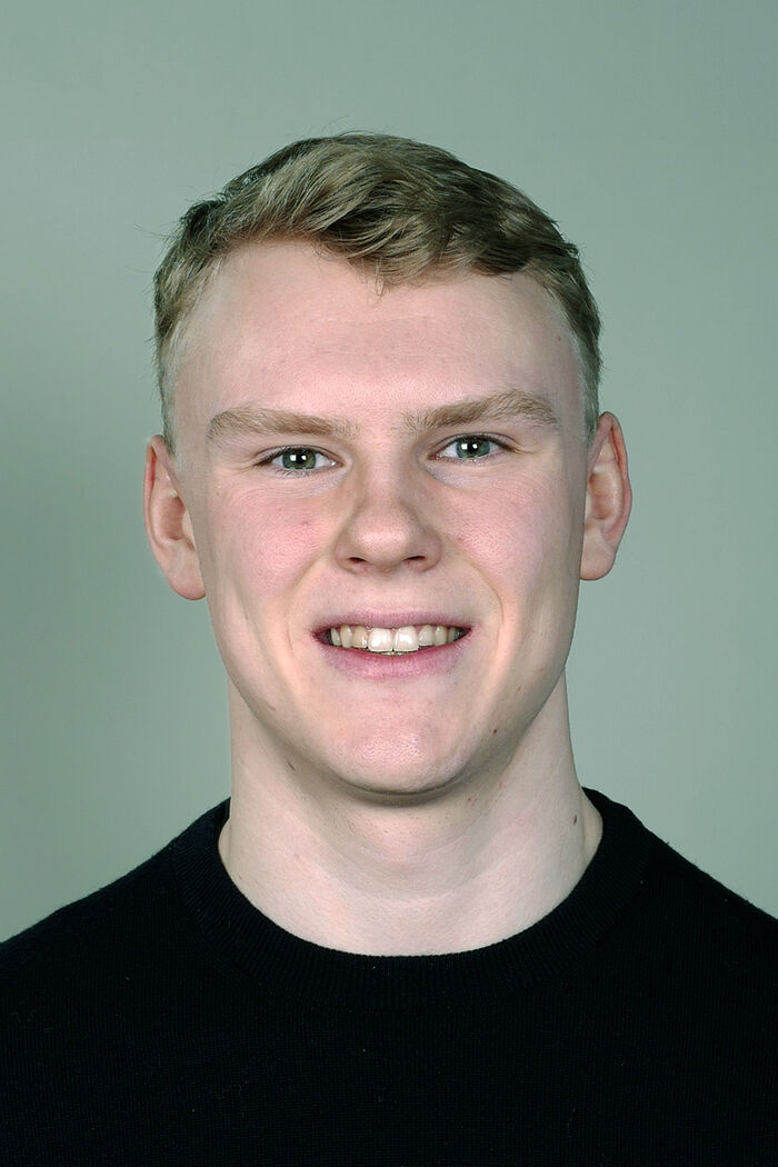 portrait photo of a young smiling man