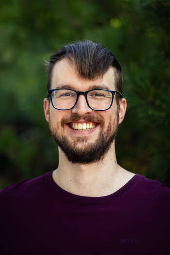 Smilende phd student