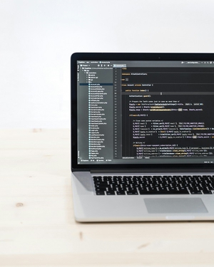 Picture of a laptop with code. 
