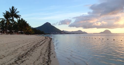 Typical view of Mauritius beachfront with volcanic mountains in background. The basaltic lavas constituting these mountains formed no older than 9 million years ago. Photo; Susan J. Webb, Prof., University of the Witwatersrand