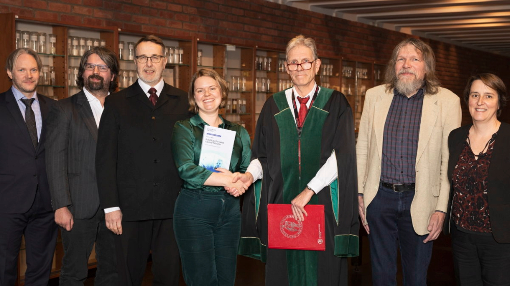 A candidate, supervisory group and committee members after the defence