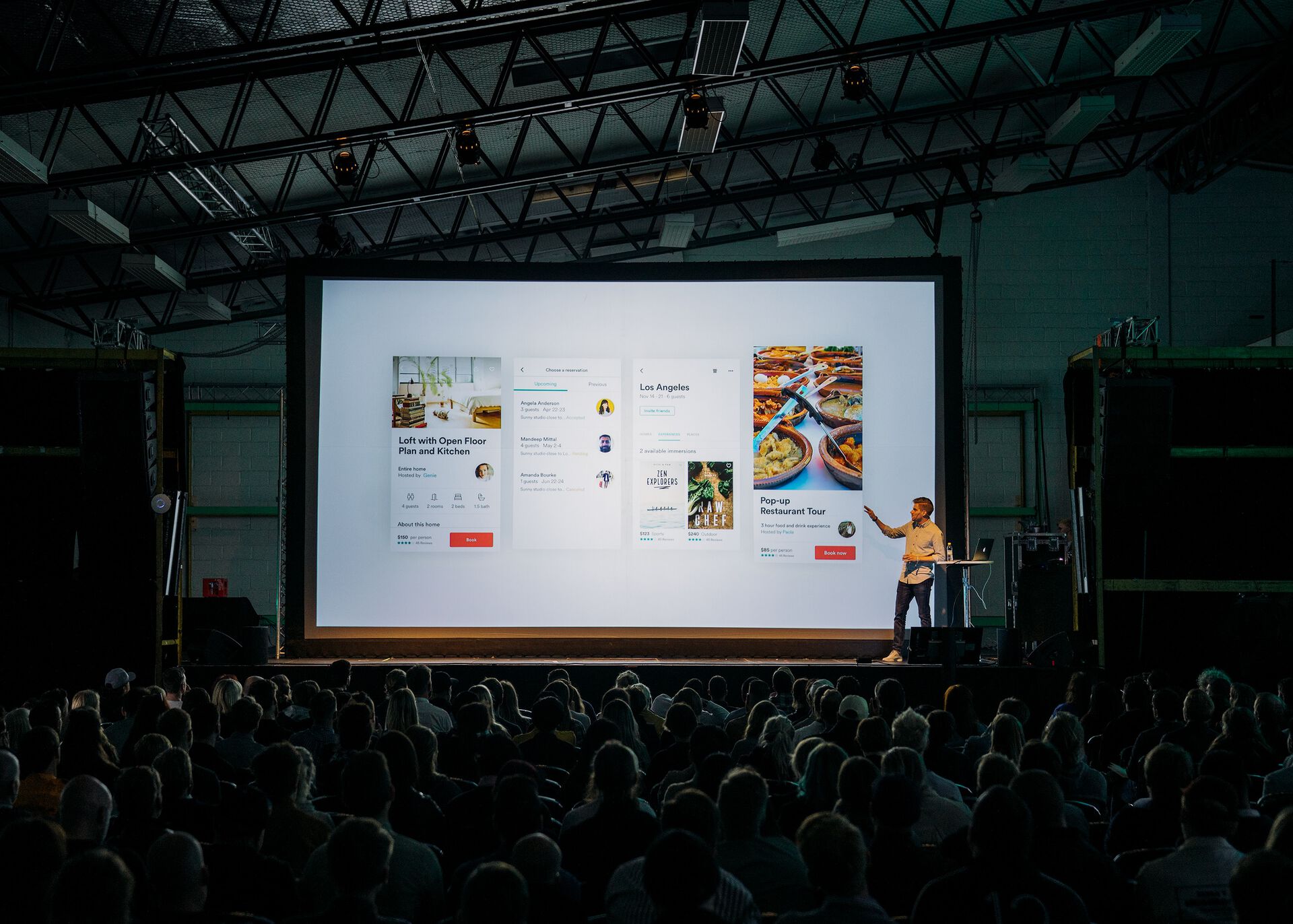 photo of person on stage giving presentation