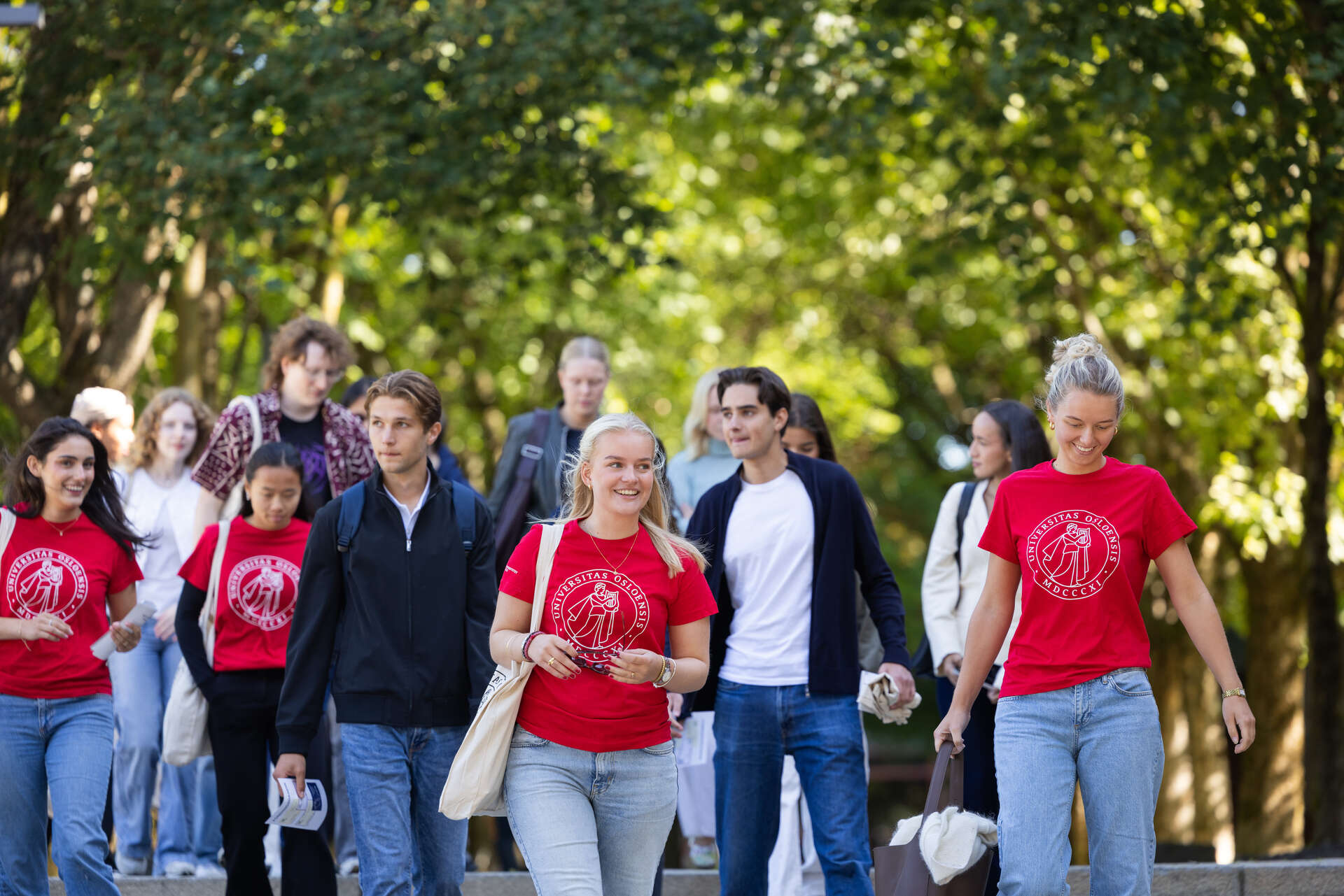 Students and student buddies walking on campus.