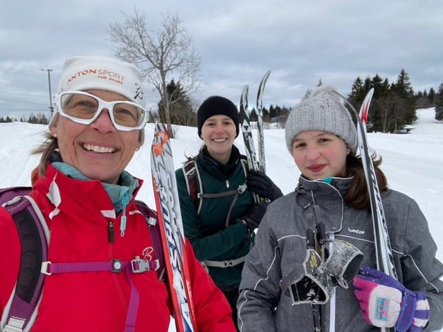 Image may contain: Smile, Snow, Sky, Cloud, Hat.