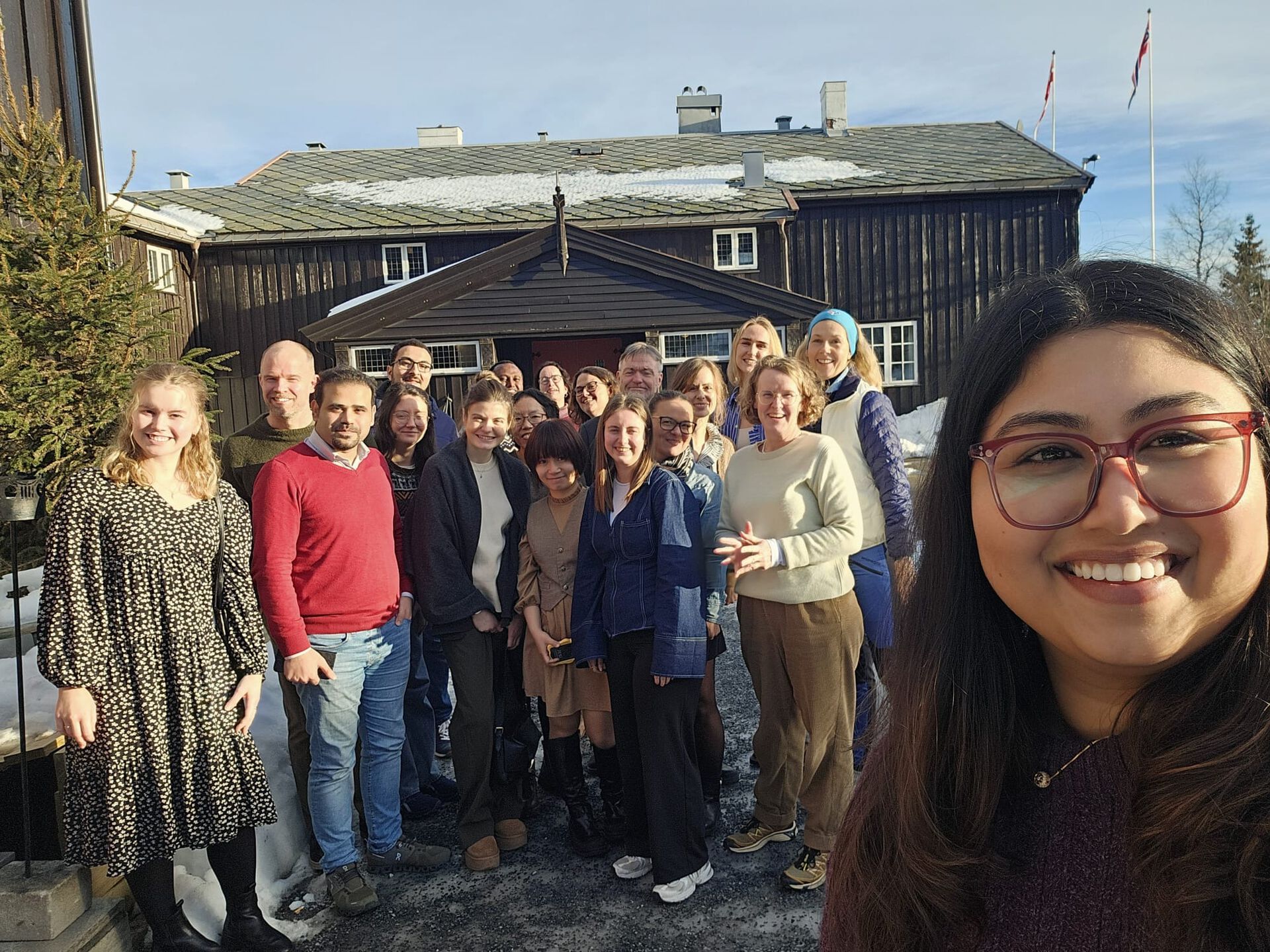 Participants of Meeting smiling outside