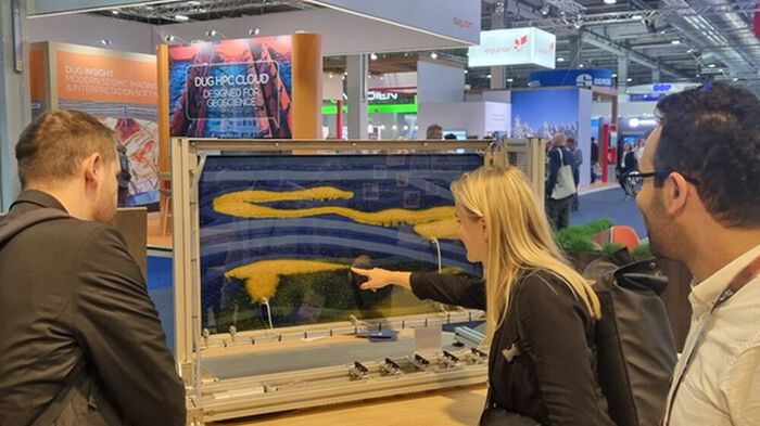 Photo: EAGE 2024 OSLO: Owen Huff, Nora Holden and Mohammad Nooraiepour discussing the live demonstration of CO2 storage in the conference exhibition area of the EAGE Annual 2024, Nova spektrum, Lillestrøm. Photo: Sian Evans