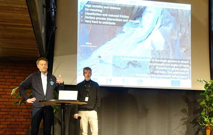 Photo: Professor Andreas Kääb to the left, answers questions from the audience about rock-ice avalanches in the Science Library, University of Oslo. On the left, meeting coordinator Prof. Joe LaCasce, Dept. of Geosciences. Photo: Gunn KristinTjoflot
