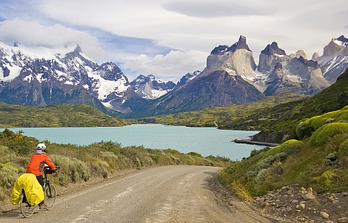 On bike with stunning views to the Cordillera del Paine from the road by Lake Pehoé. Note the highest peaks to the right - a large interleaving of white granite. Photo: Galland/Sassier
