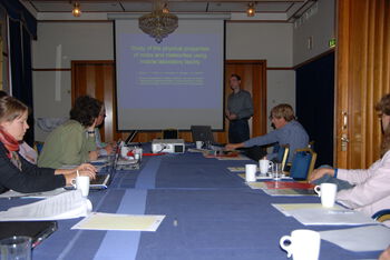 Table ,Conference room table ,World ,Coat ,Interaction.