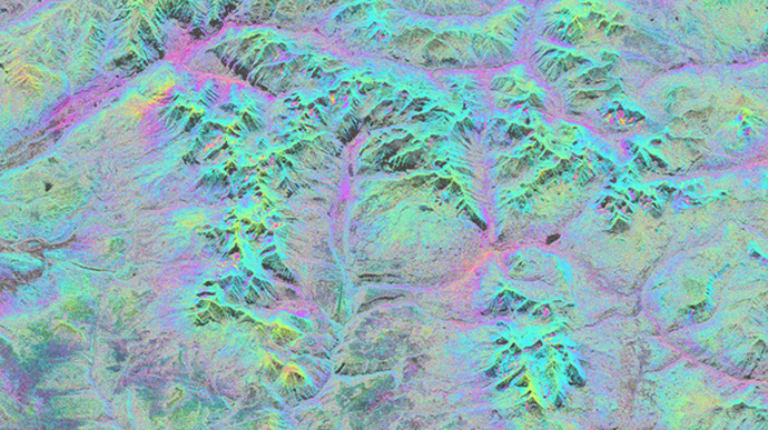 Image: This is an interferogram calculated from two satellite radar images over Telluride and the San Juan mountains in Colorado, USA. The small colour disturbances in some mountainsides indicate the tiny movement of streams of frozen material, known as rock glaciers. The new study shows that climate change is accelerating the movement of these landscape features across the western United States, including in the San Juan Mountains. The real width of the image is 50 km. Image: Interferogram, Kääb/Røste.
