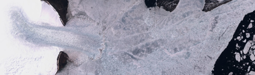 Figure 1: The a glacier surge from Vavilov ice cap advances into the sea and breaks the melting sea-ice (Severnaya Zemlya), the image is taken by the Sentinel-2 satellite. Image: Project team