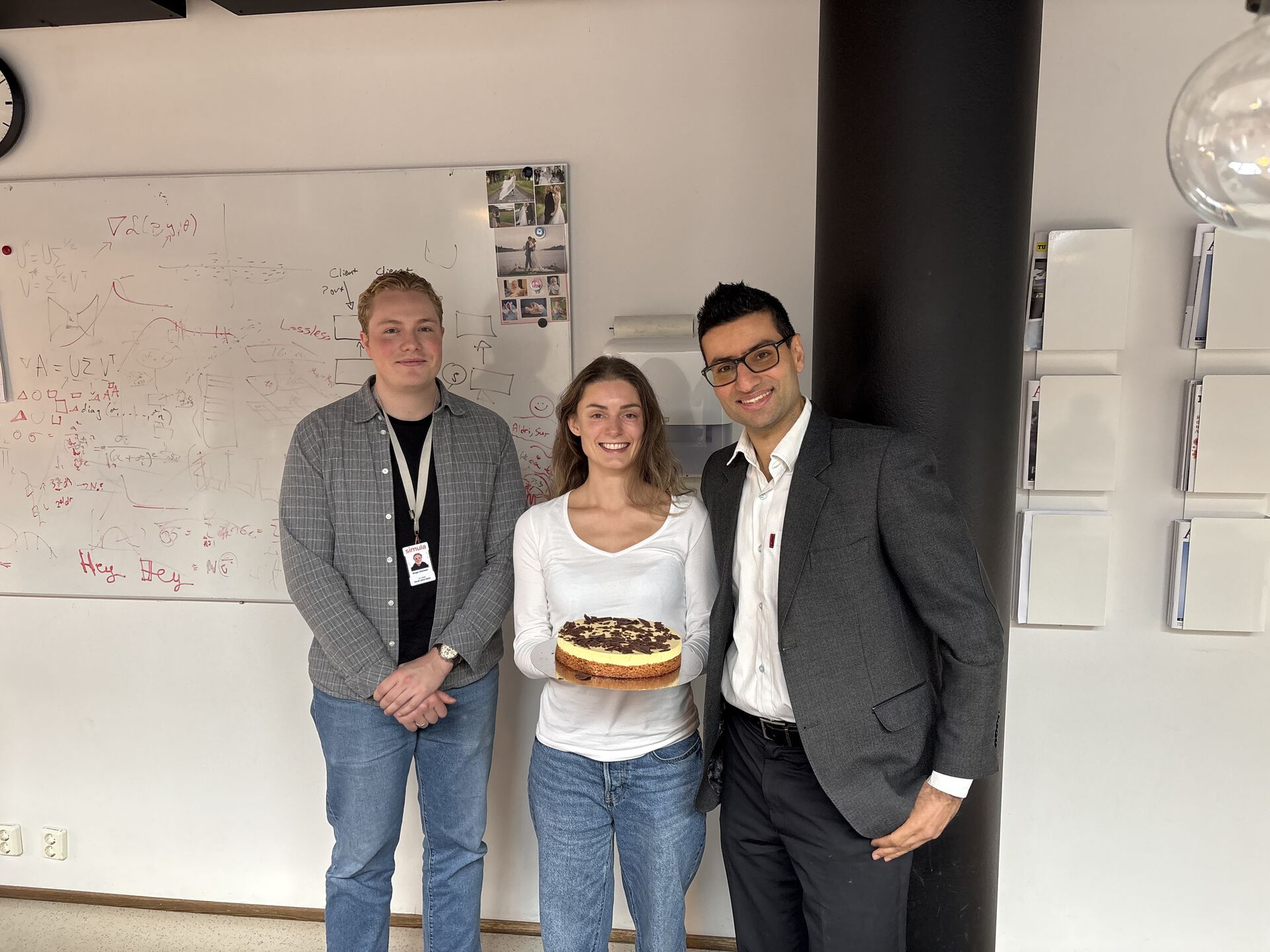 Celebrating the accepted paper with a cake for the research group