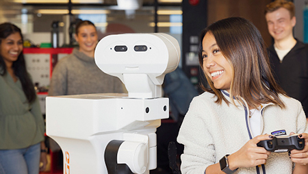 A young woman with a robot