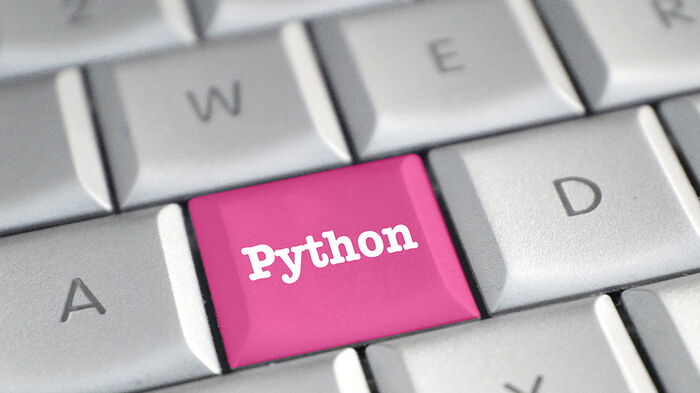 Tastatur med en rosa knapp det st?r Python p?