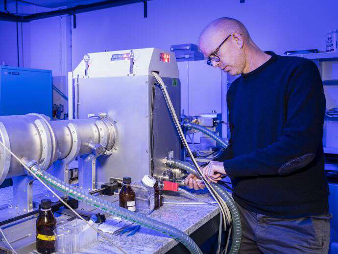 One male chemist at his nano chemistry laboratorium.