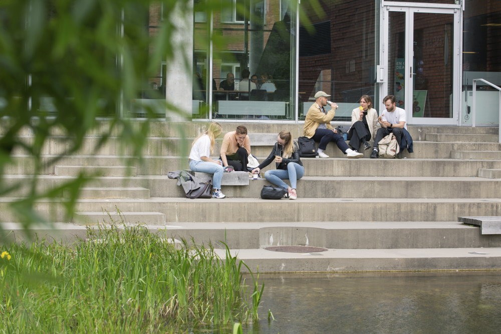 A group of people sitting and talking together.