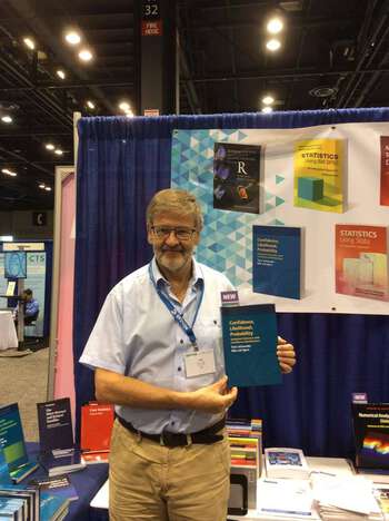 "Nils Hjort with his latest book", as tweeted by Cambridge University Press, JSM 2016.