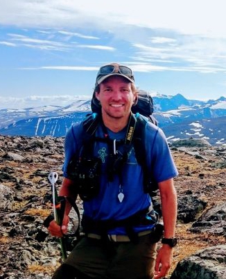 Image may contain: Cloud, Sky, Mountain, Smile, Hiking equipment.