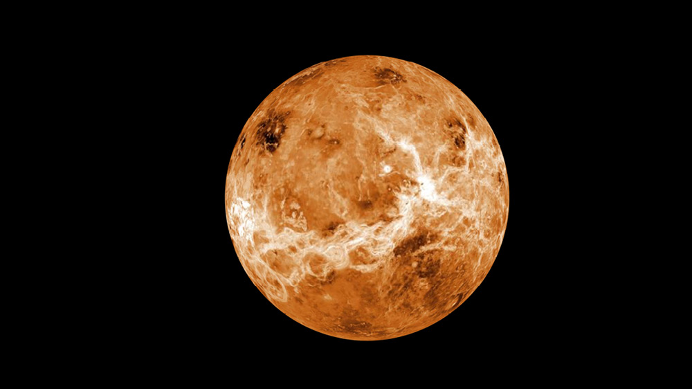black background and an orange like planet reminding of Venus