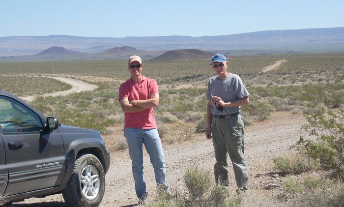 Three small volcanic cone within Crater Flat, Nevada, which are an example of intraplate volcanism. Shown in the foreground are PHAB’s Clint Conrad and Gene Smith, a former professor of volcanology at the University of Nevada at Las Vegas.