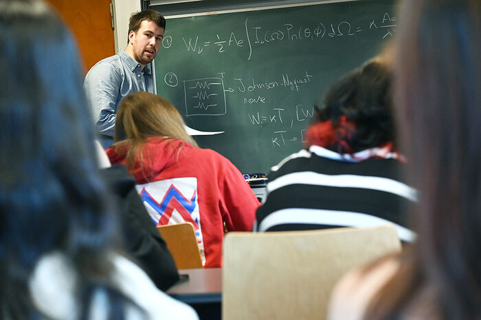 Young, male teacher from Spain in the classroom
