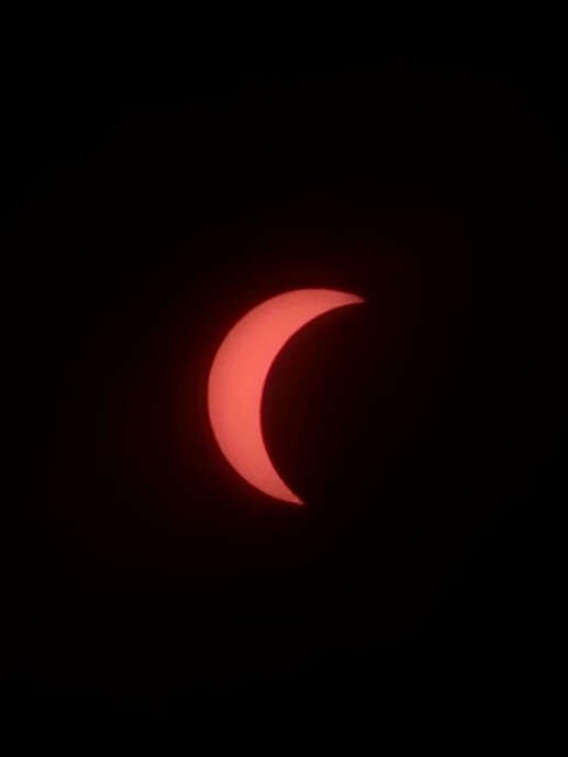 Image may contain: Moon, Crescent, Astronomical object, Eclipse, Orange.