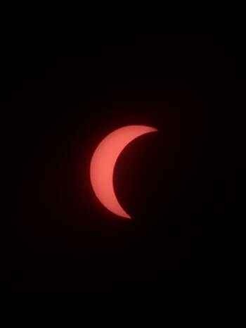 Image may contain: Moon, Crescent, Astronomical object, Eclipse, Orange.