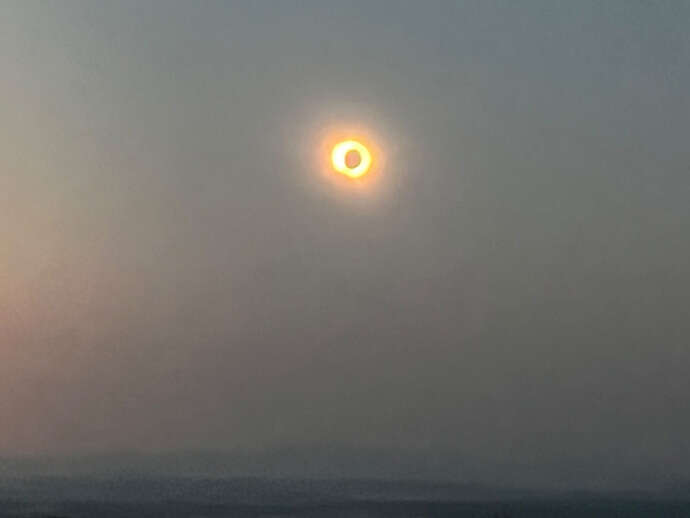 Image may contain: atmospheric phenomenon, Orange, Astronomical object, Celestial event, Evening.